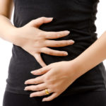 Woman suffering from Leaky Gut Syndrome