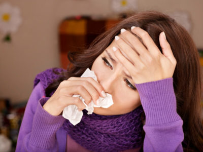 Woman suffering from flu symptoms