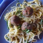 Yellow squash noodles with meatballs and olive tapenade